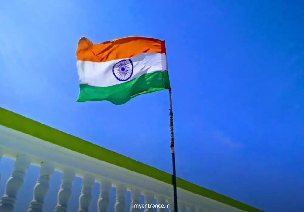 Indian family hoisting Tiranga flag on balcony during Har Ghar Tiranga campaign, symbolizing unity and patriotism.