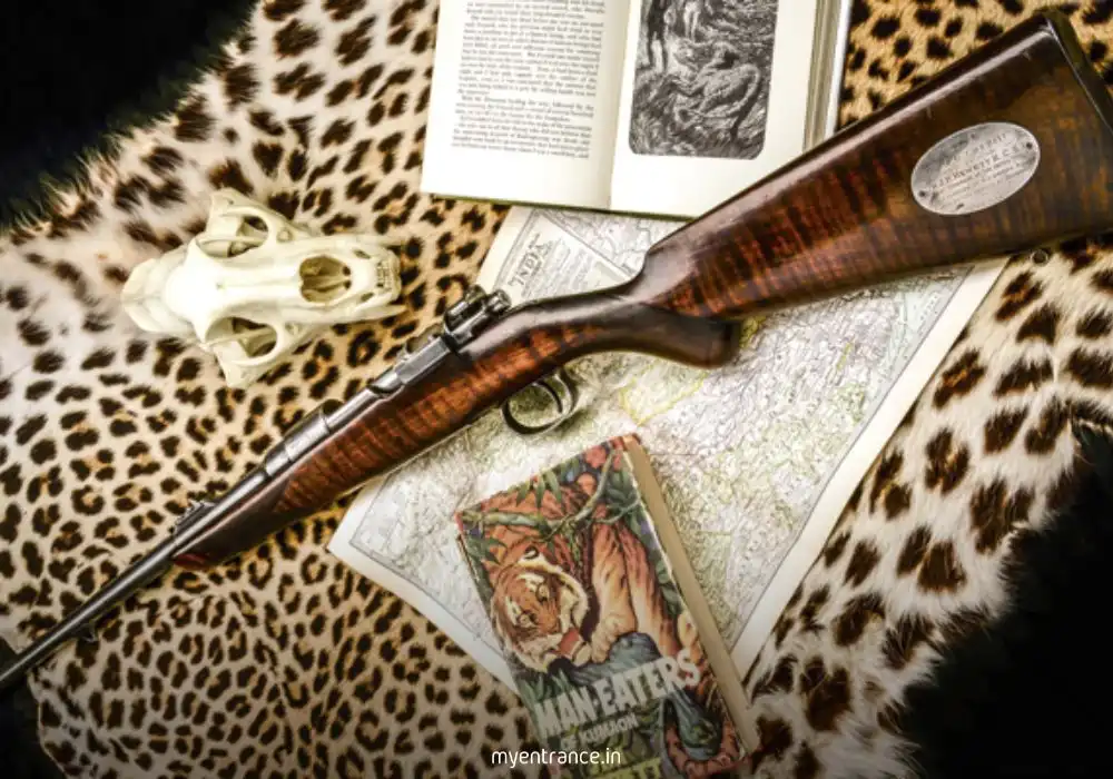 Close-up of weathered copy of Jim Corbett's "Man-Eaters of Kumaon" resting on jungle foliage, symbolizing nature observation and storytelling.